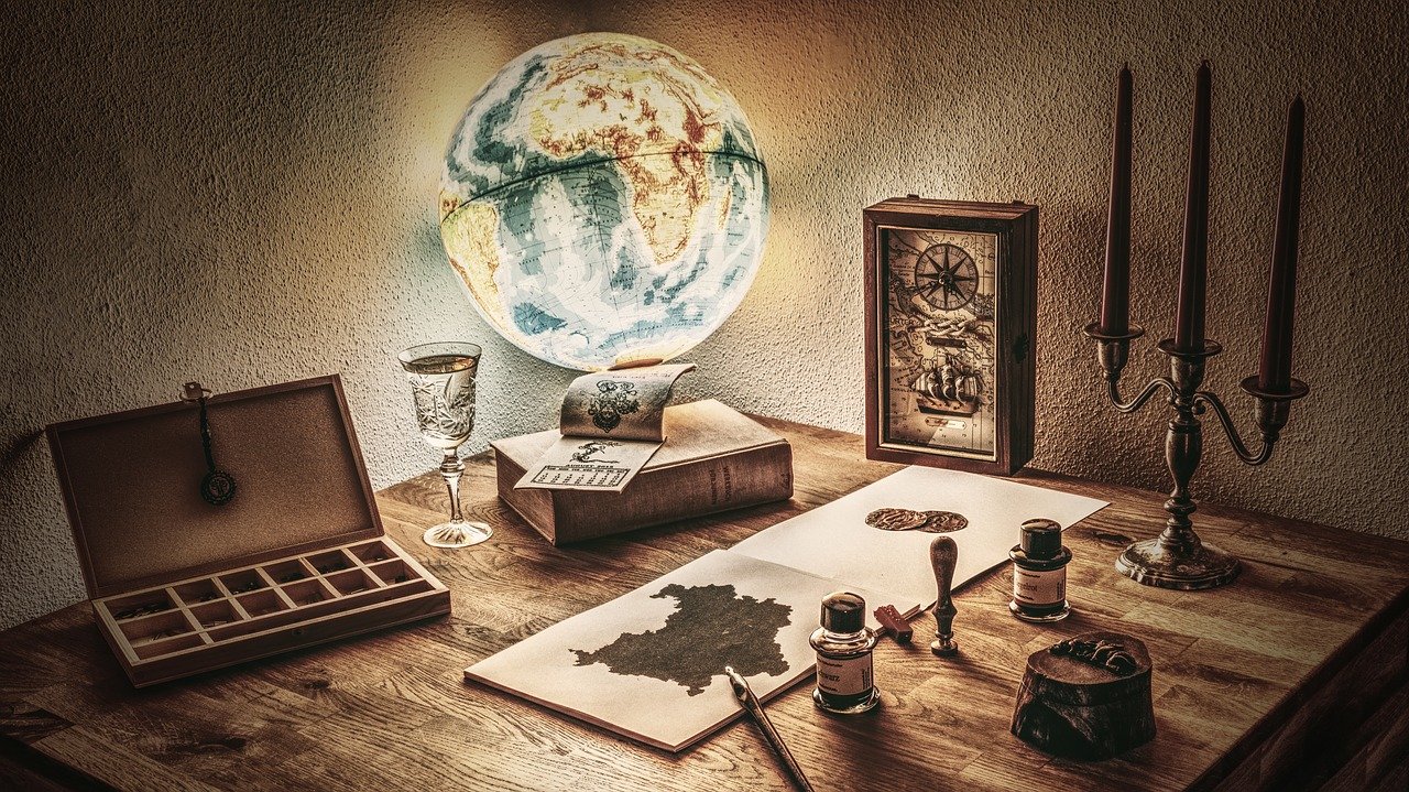 Explorer's desk with globe — start a project